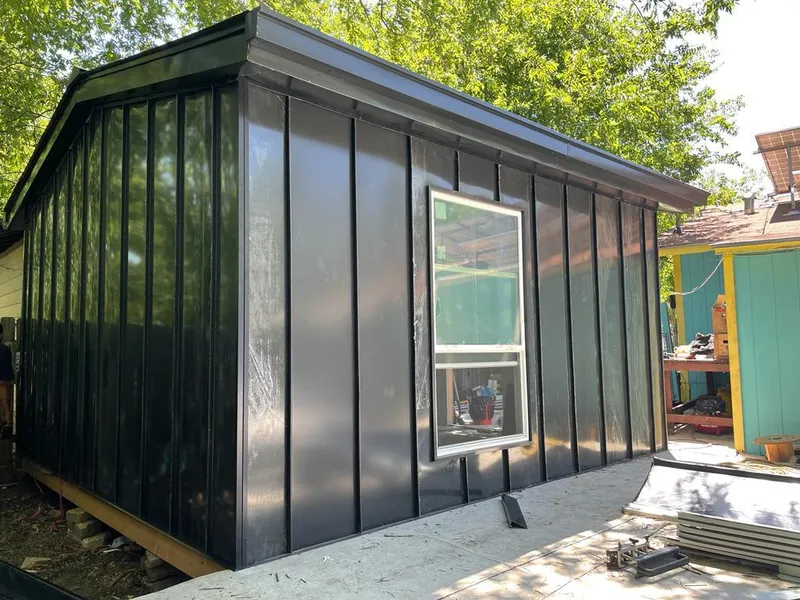 Black standing seam metal wall panels for Roof Inspection in Faribault