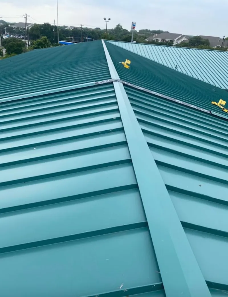 Green commercial metal roof ridge and valley for Metal Roof Repair in Faribault